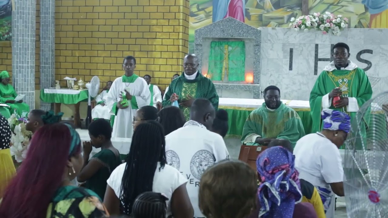 Fr. Agi Livinus receiving gifts from parishioners