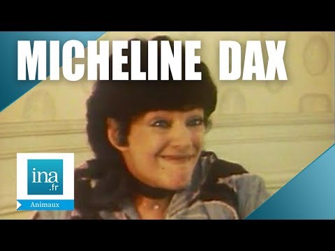 Micheline Dax chez elle avec son chat | Archive INA