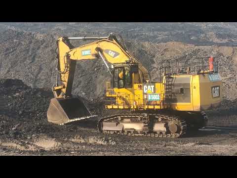 Excavator 6015B Caterpillar loading Big truck