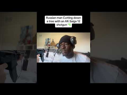 Russian man Cutting down a tree with an AK Saiga 12 shotgun🔫