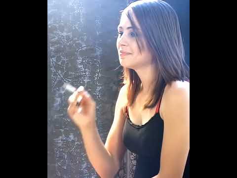 Cute girl smoking in the sofa_ cute smoking girl _ smoking girl in Black