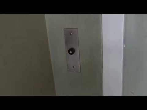 EPIC MOTOR on TINY, ANTIQUE Otis Black Button Traction Elevator at 35 W. Pine St., Orlando, FL