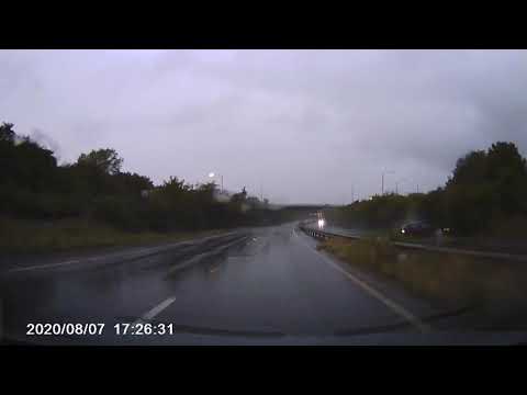Dashcam footage of car aquaplaning ,spinning and crashing in bad weather
