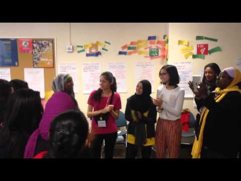 Suhaila and other child delegates listen to Suhaila's song for the first time