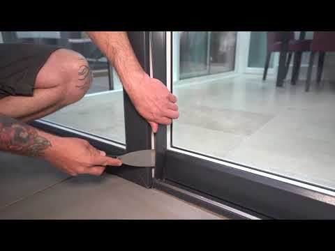 Part of a video titled How to Lubricate Sliding Doors Wheels - YouTube