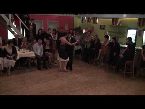 Adrian Costa and Amanda Costa are dancing to a tango