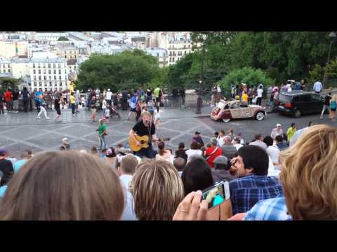 Music on the steps outside Sacre Coeur in Paris, France