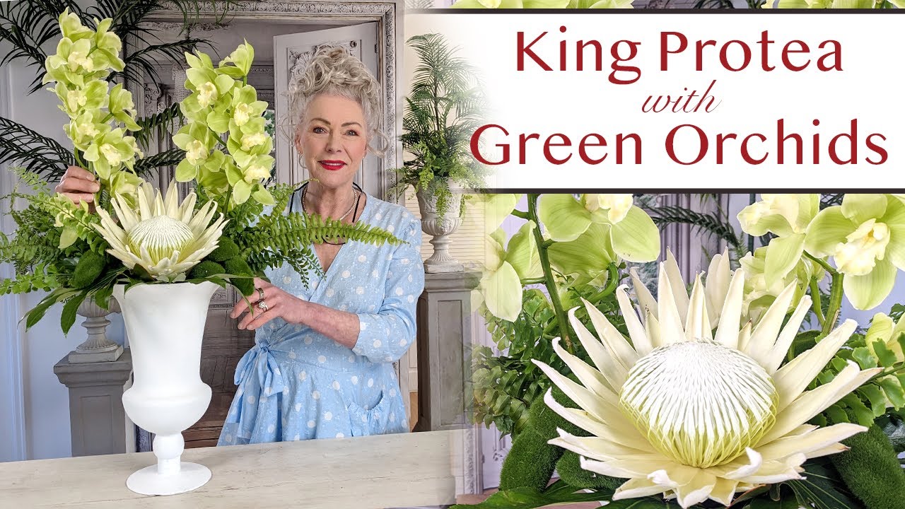 King White Protea with Lime Green Cymbidium Orchids | A floral design in a classic white urn