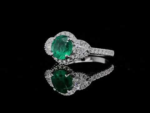 Emerald and diamond halo ring with pear side stones in 18k white gold - Orogem Jewelers