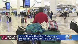 Storm and brutal cold snarl Christmas travel plans for many