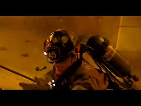 Trailer frame: interior blaze with hose team advancing, strings driving the push