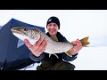 Video Thumbnail for Ice Fishing in a winter storm for lake trout