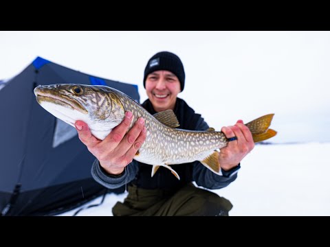 Ice Fishing in a winter storm for lake trout