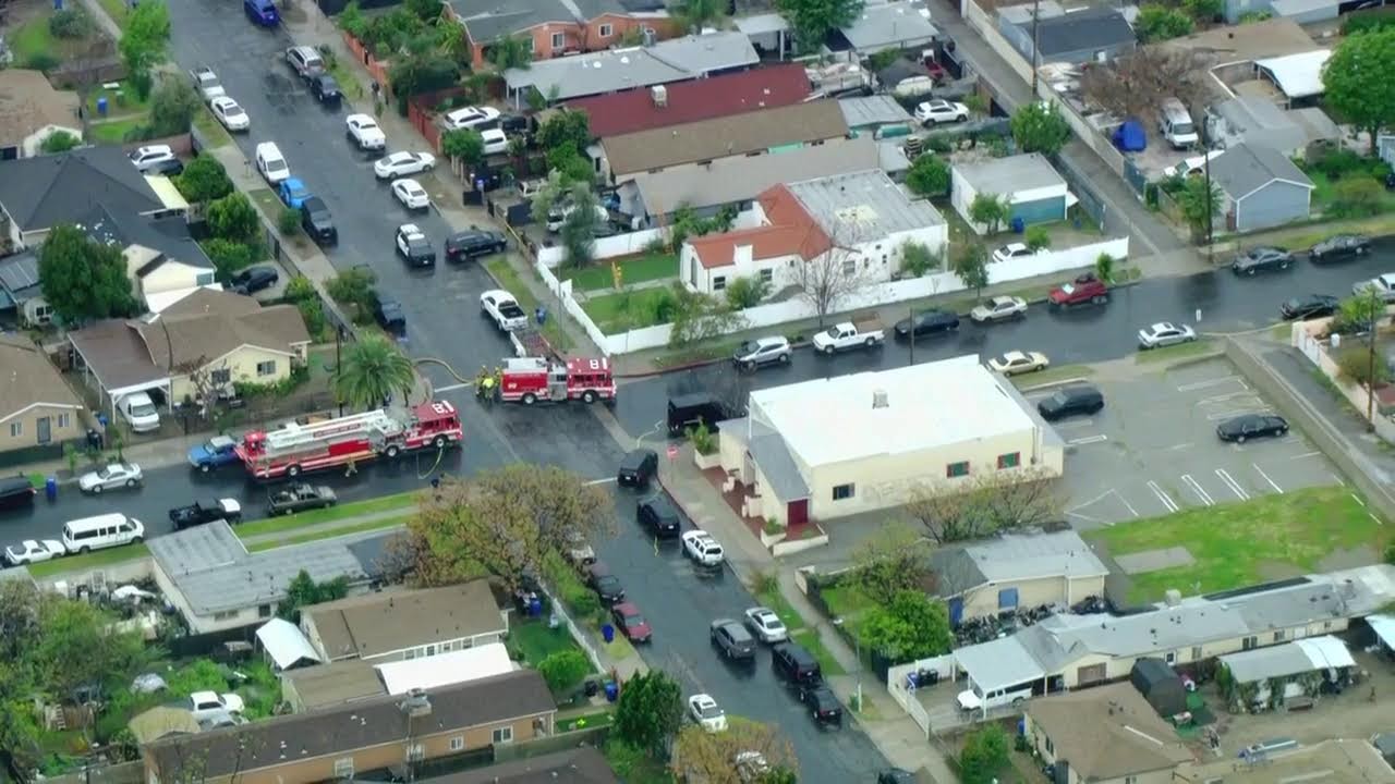 LIVE SKYFOX: SWAT operation as Burglary suspect barricades in burning LA home