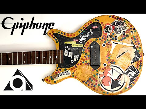 I restored a junk guitar covered in stickers.