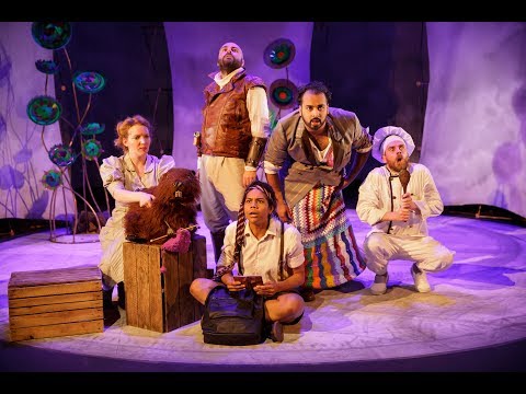 Stage trailer shot: the Bellman rallies the crew; lighting cues suggest brass-forward, march-like music