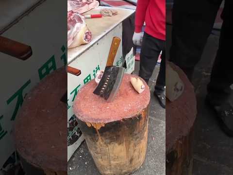 Sharp Chinese meat cleaver, cuts through pork leg bones easily