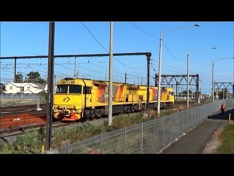 AURIZON Rail And QR National's 6027-6021 Light rail pass Newport