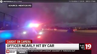 WATCH: Mentor Police Officer almost hit by driver during traffic stop