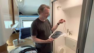 The Laveo Dry Flush toilet in our Happier Camper HCT