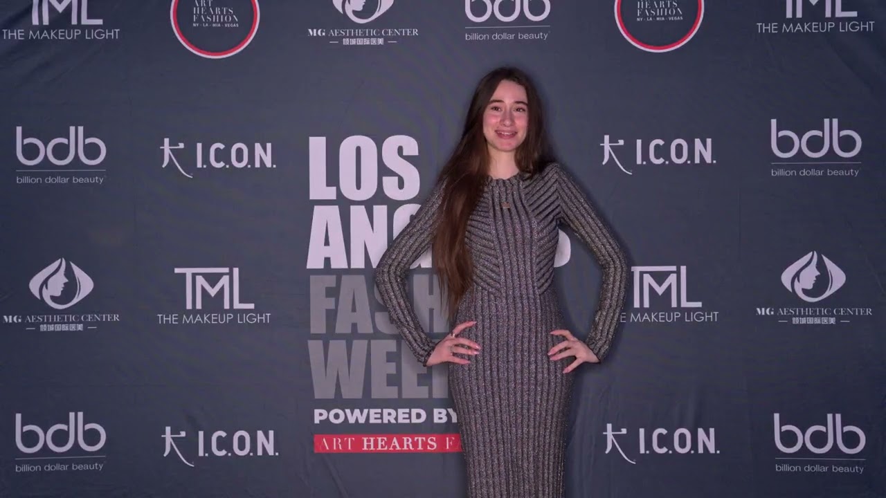Ava Cherlyn poses with runway model Mona backstage at Artheartsfashion LAFW