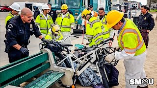 𝗟𝗢𝗖𝗞𝗘𝗗 𝗗𝗢𝗪𝗡: LAPD and Crews Confront Secured Belongings During Venice Boardwalk Sweep