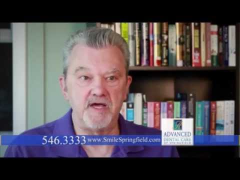 Man in Springfield in front of a bookshelf