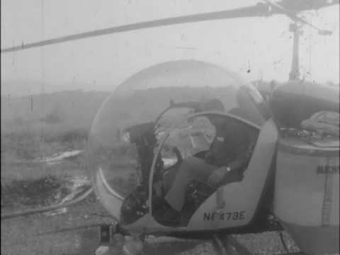 05/18/62 Appalachian Power Company uses helicopters to spray weed killer along the power line r...