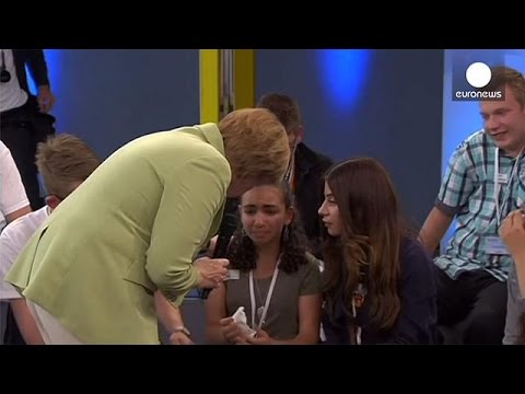 #Merkelstrokes: the German Chancellor is confronted by a crying refugee