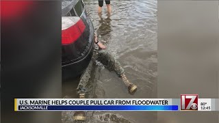 US Marine helps pull car from floodwaters