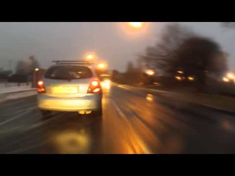 filtering through traffic in heavy snow