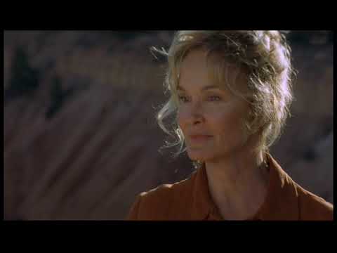 Bonneville trailer still—desert sun through the windshield, hands on the wheel