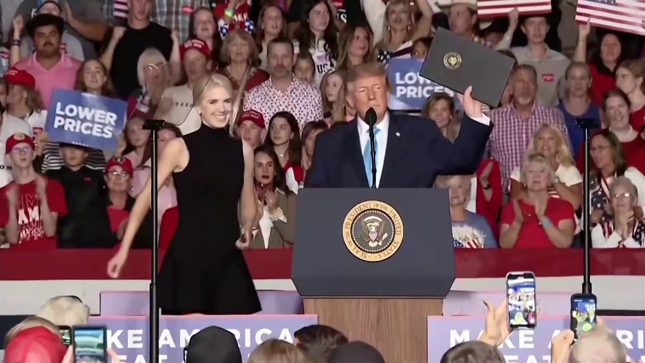 Donald Trump has 'perfect' Natalie Harp bring executive order on stage for signing at Nebraska rally