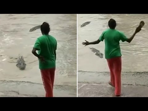 Woman shoos away a croc with just her flip-flops