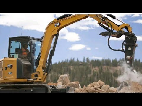 Liebherr 954 Long Reach Excavator And Cat 385C Demolish Building.
