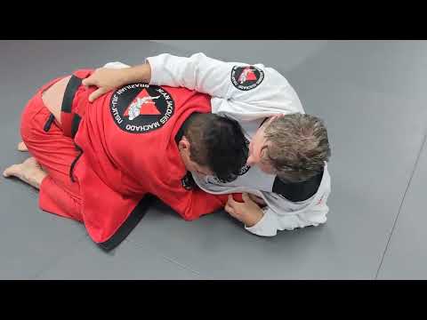 Jean Jacques Machado Rolling with (bigger) Black Belt Student