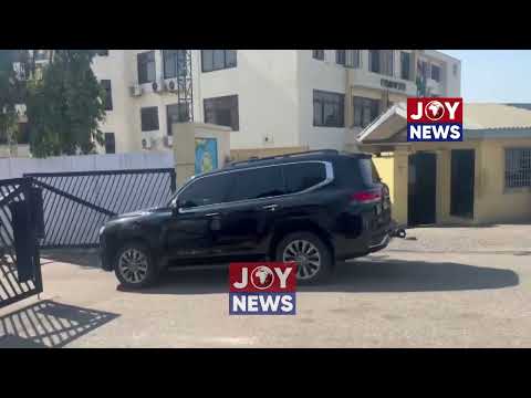 EOCO officials return from the residence of Nana Agyei Baffour after conducting their search.