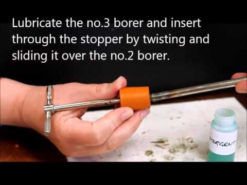 Inserting tubing through a rubber stopper