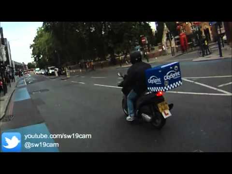 BMW - cyclist collision.  Who is to blame? (silly cyclist)