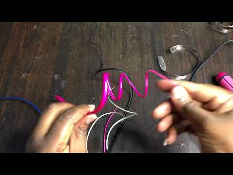 Part of a video titled DIY How to Curl an OSTRICH QUILL. - YouTube