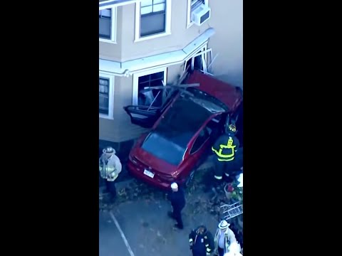 Two people injured after car crashed into Boston home