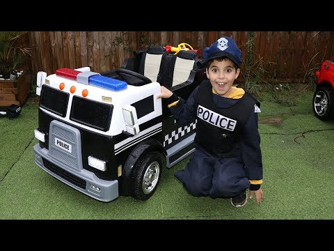 SAMI plays with his new police truck