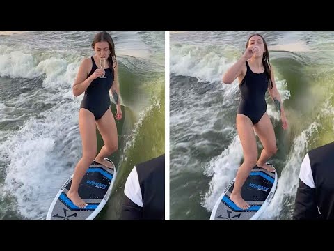 Girl Drinks Champagne While Wakesurfing