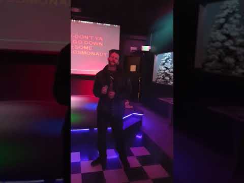 Curtis singing karaoke at Louie's. Cracker low