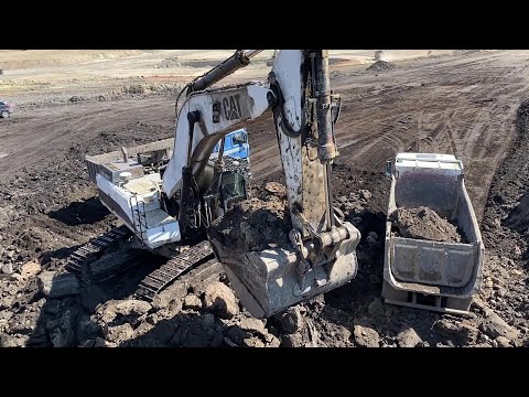 Caterpillar 375 Excavator Loading Mercedes And MAN Trucks