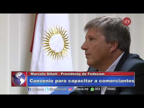 Firma de convenio para capacitar comerciantes.