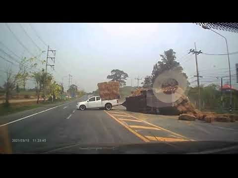Truck Hauling Massive Straw Load Takes Turn too Fast || ViralHog
