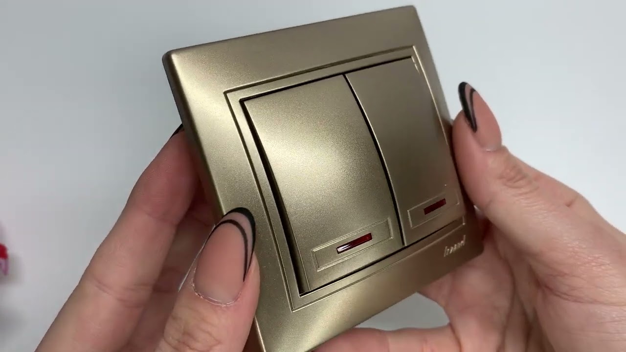 Вимикач двоклавішний з підсвіткою MIRA світло-коричневий перламутр з вставками 701-3131-112