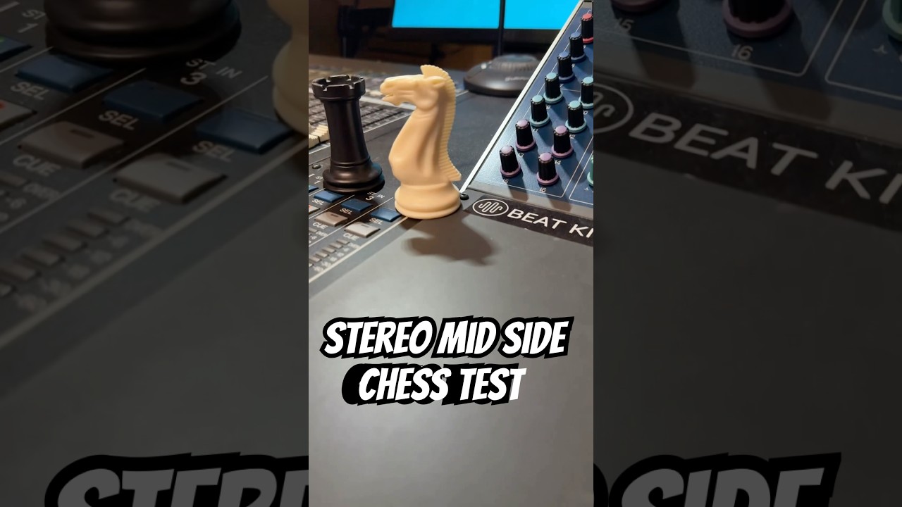 Chess pieces and audio cables on a chessboard atop a piano
