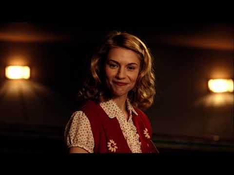 Trailer shot of Orson Welles directing actors under bright stage lights